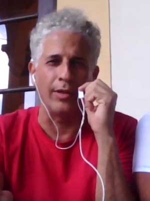 Man with headphones speaking