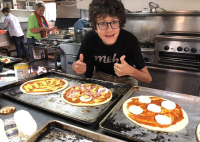Teen making pizza