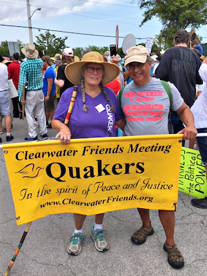 Two people holding banner